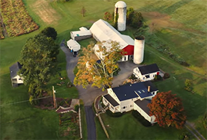 Farm buildings with fields